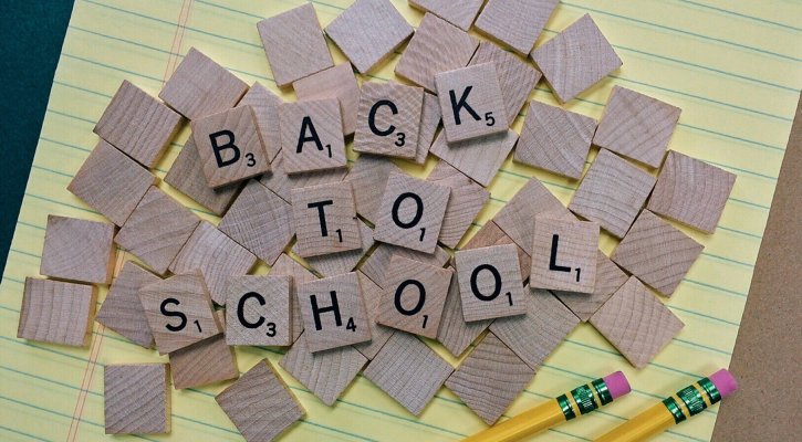 back to school spelled in game tiles
